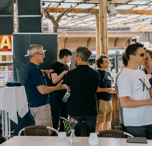 Malcolm and other JUXTers talking at a conference